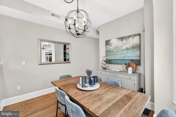 a kitchen with a refrigerator sink and cabinets