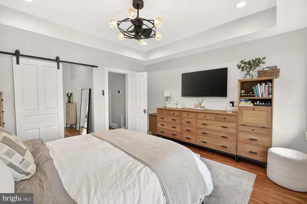 a view of walk in closet with clothes