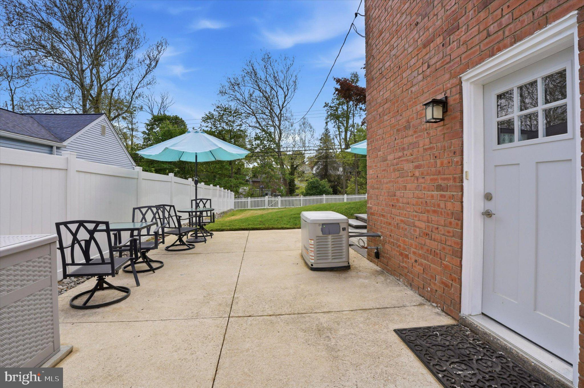 308 Lewis Road Springfield, PA 19064 - Photo 33 of 34 Charming patio with serene greenery.