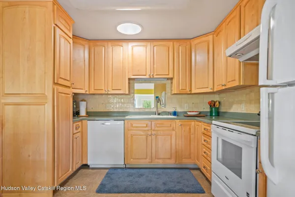 a dining room filled with furniture and a fireplace