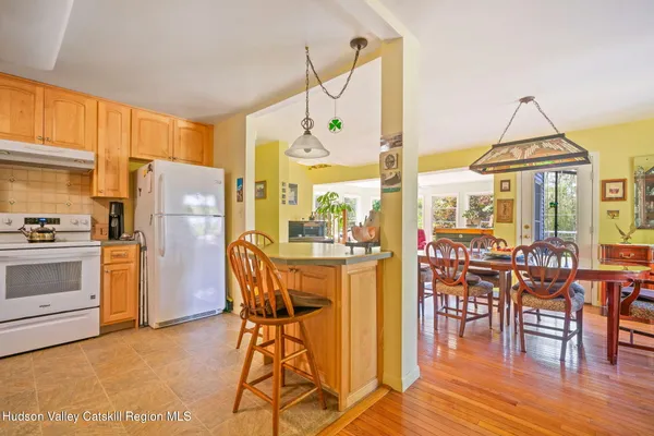 a view of a dining room with furniture window and outside view