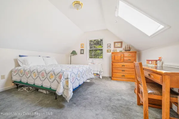 a bedroom with a bed and a tv in it
