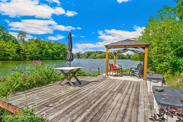 a view of a wooden floor and a lake view