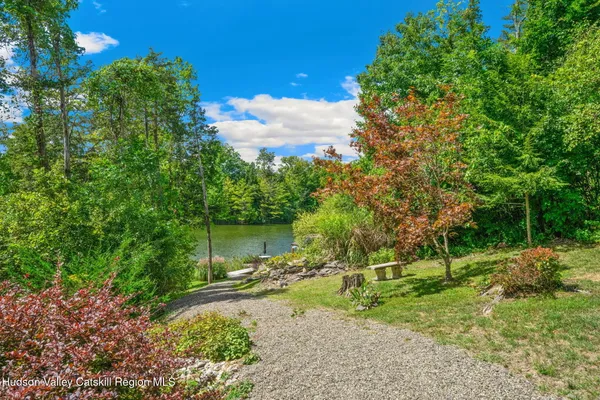 a view of deck with chairs and wooden floor