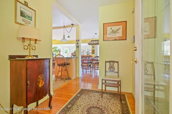 a living room with patio furniture and a fireplace