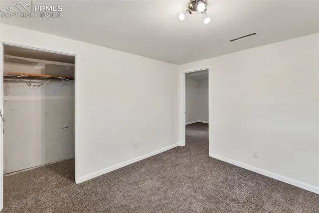 an empty room with a bathroom