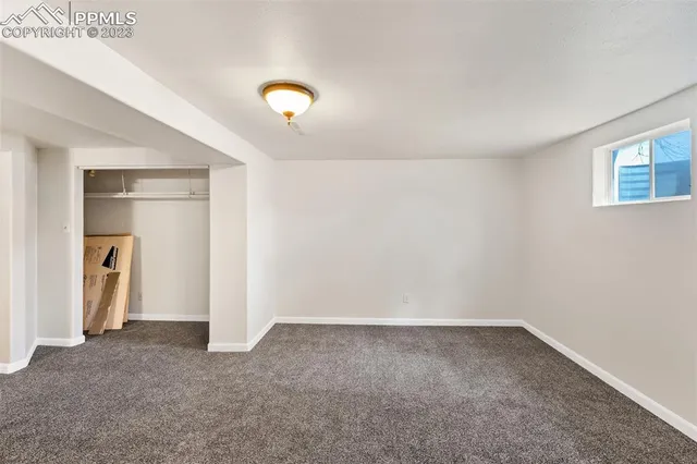 an empty room with a empty space and window