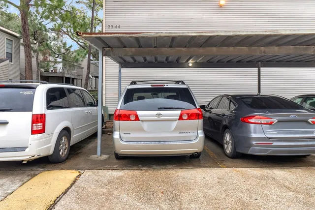 a view of cars parked in a parking space
