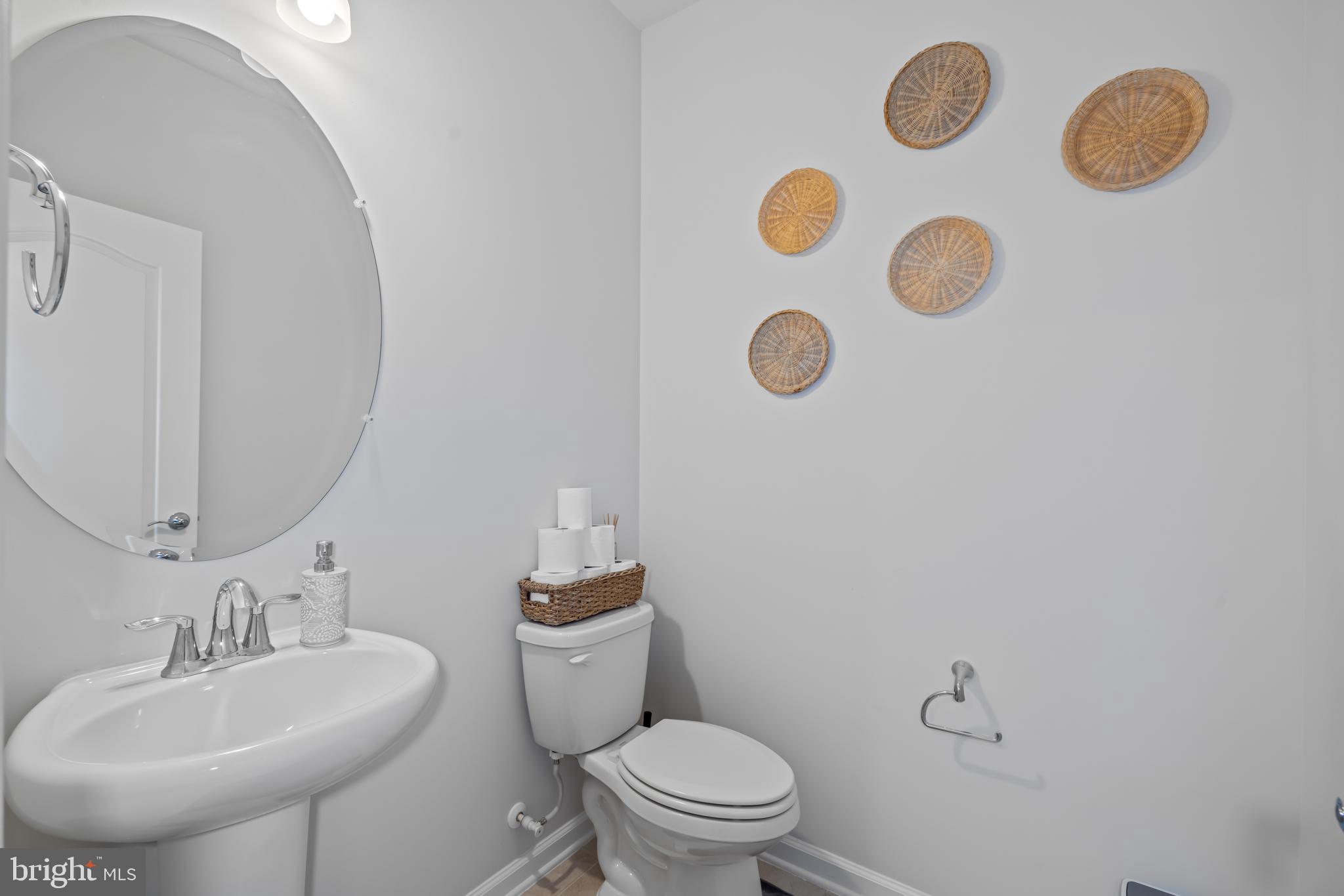 7715 Cresap Lane Hanover, MD 21076 - Photo 35 of 42 a bathroom with a sink mirror and toilet