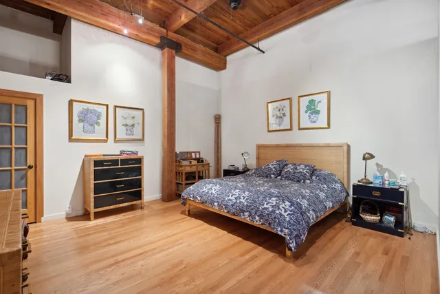 a bedroom with a bed and a dresser