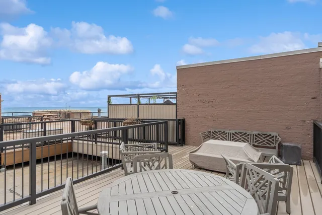 a view of balcony with wooden floor and city view