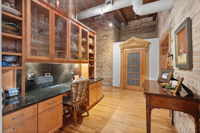 a dining room with furniture and a window
