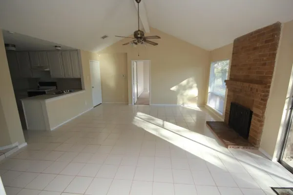 a view of a kitchen with a sink and a stove top oven