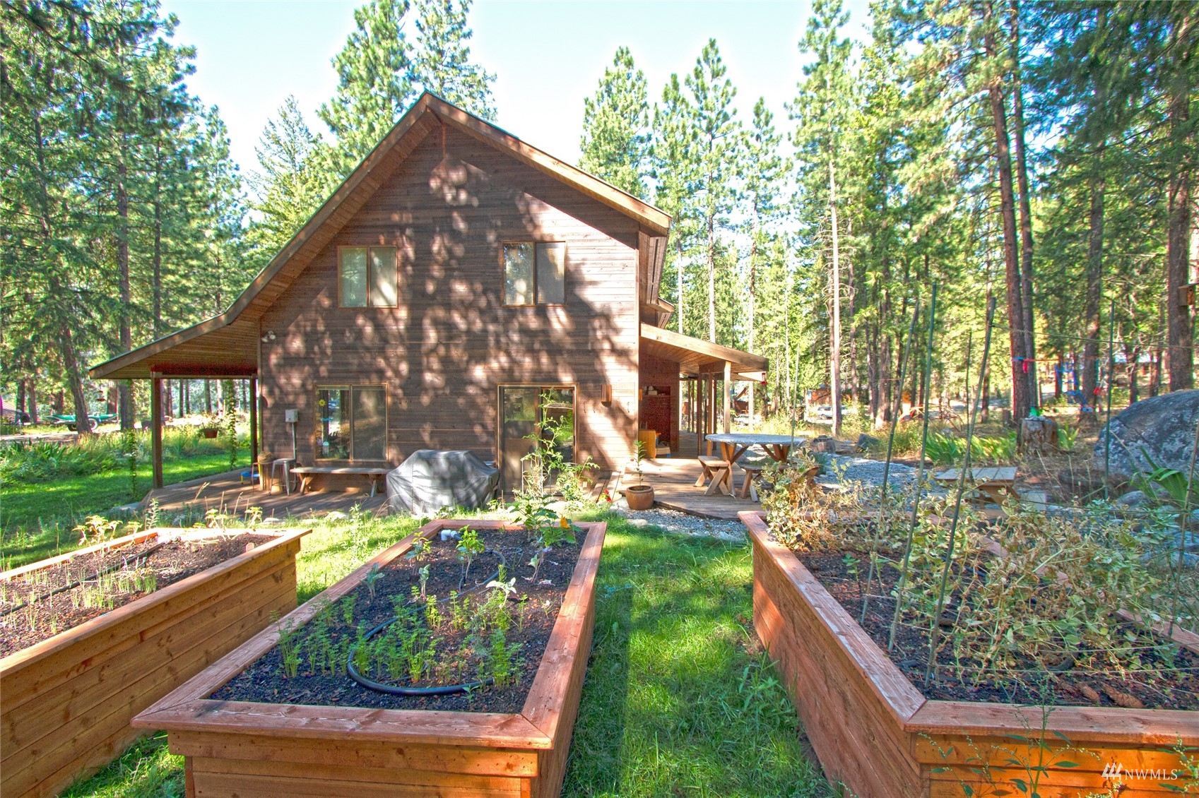 12 Bitterbrush Road Winthrop, WA 98862 - Photo 36 of 39 a backyard of a house with seating space