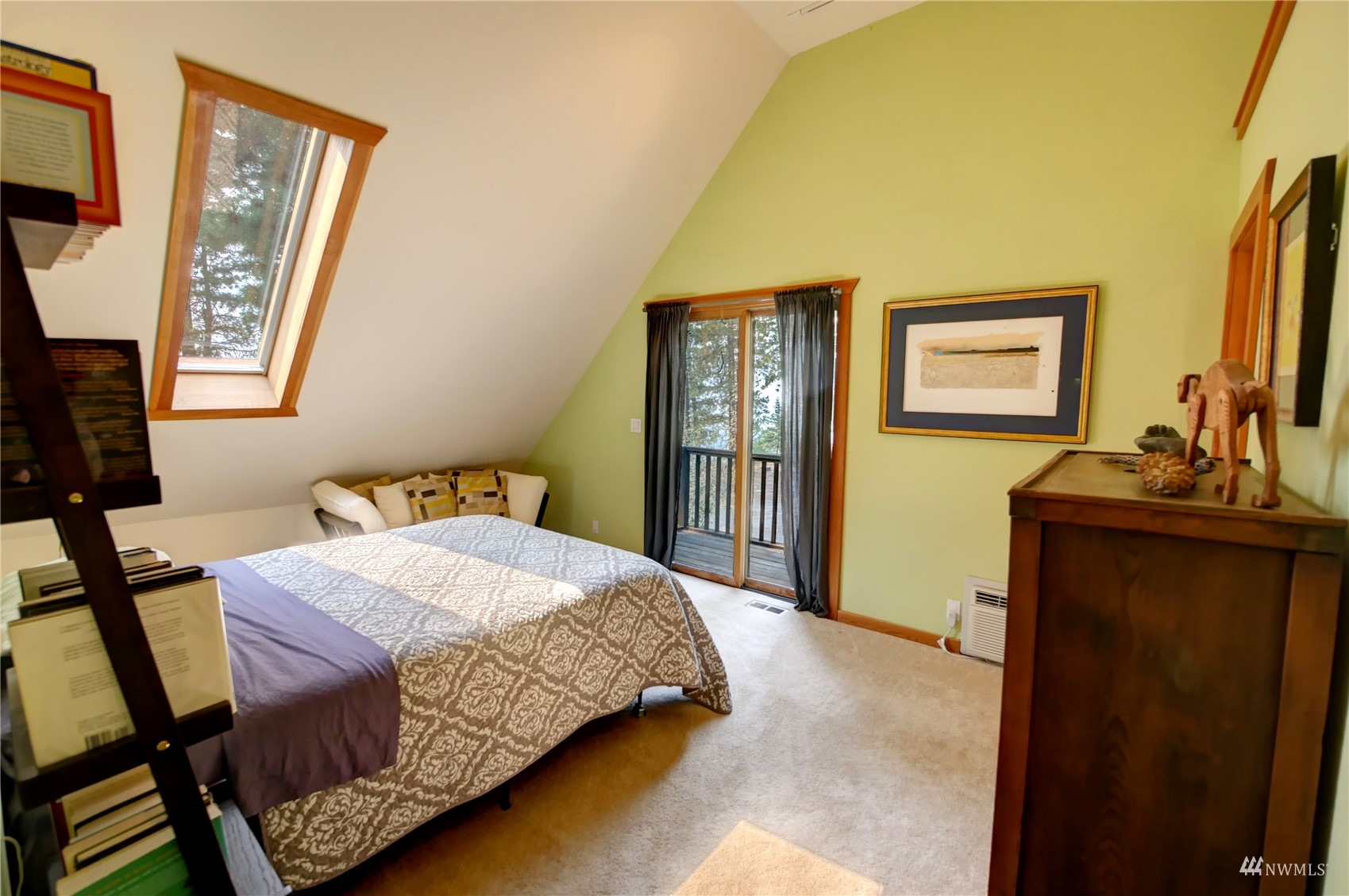 12 Bitterbrush Road Winthrop, WA 98862 - Photo 5 of 39 a bedroom with a bed a mirror on dresser and a window