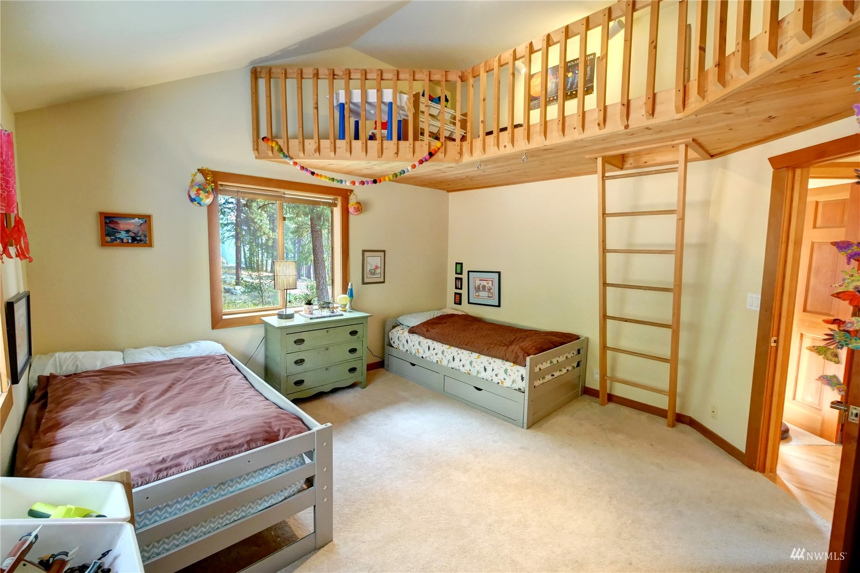 12 Bitterbrush Road Winthrop, WA 98862 - Photo 6 of 39 a bedroom with a bed a dresser and windows