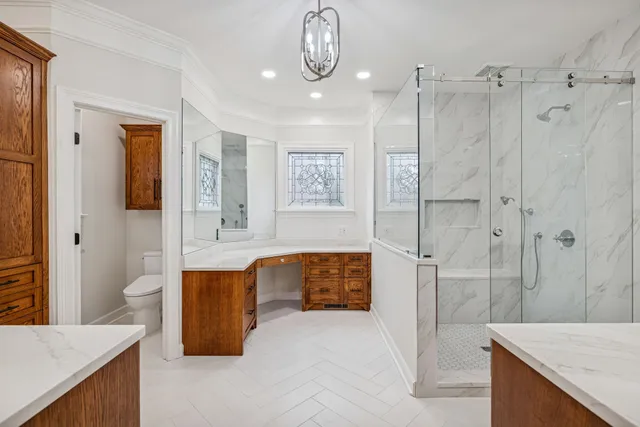 a bathroom with a shower and a glass door