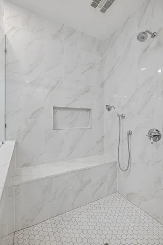 a bathroom with a tub sink and window