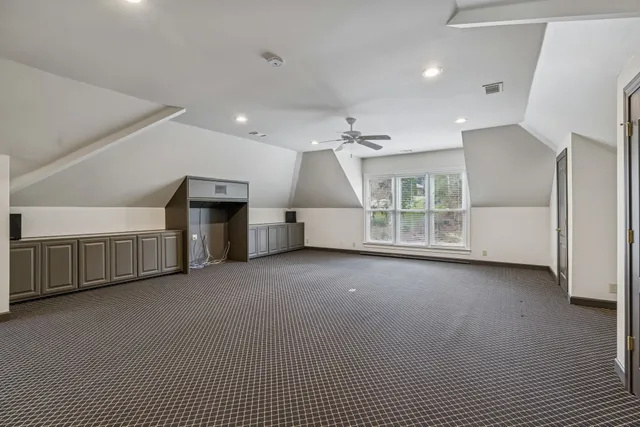 a view of a livingroom with furniture and natural light