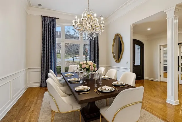 a view of a dining room with furniture window and wooden floor