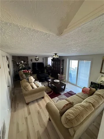 a bedroom with furniture and a fireplace