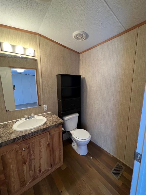 1647 Stonecrest Road Argyle, TX 76226 - Photo 15 of 16 a bathroom with a granite countertop sink toilet mirror and a shower