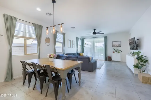 a view of a dining room with furniture and window