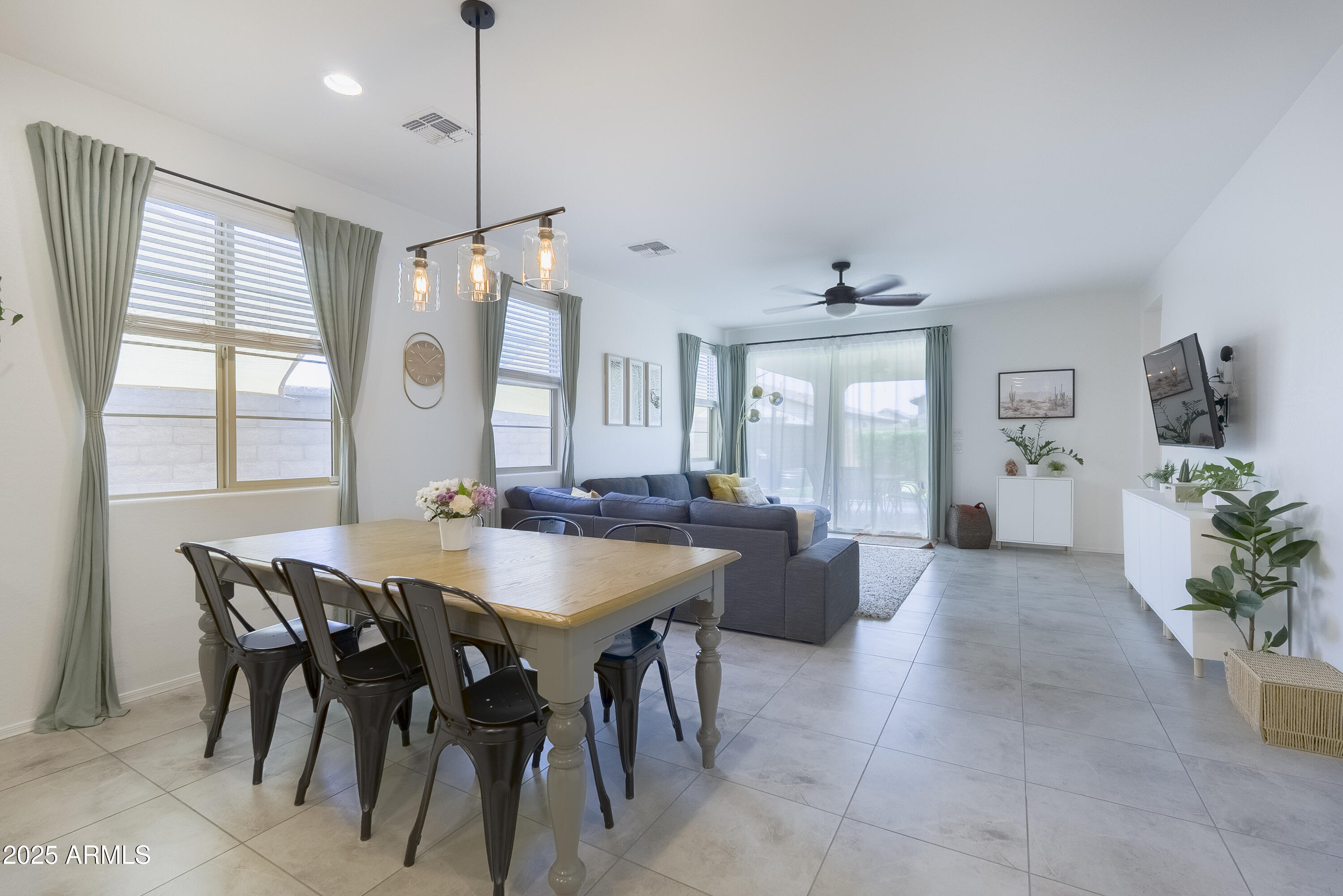 22638 East Quintero Court Queen Creek, AZ 85142 - Photo 12 of 39 a view of a dining room with furniture and window