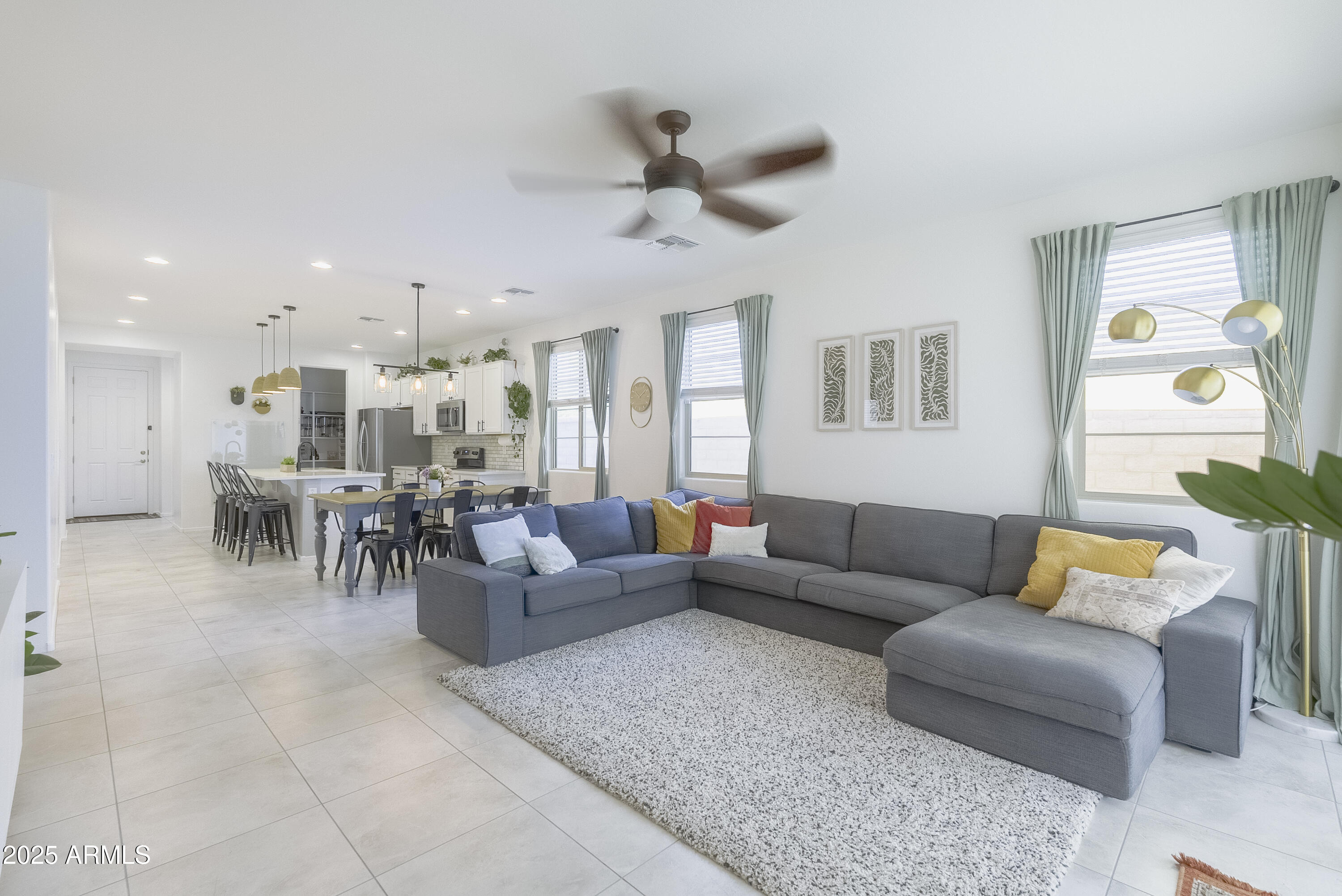 22638 East Quintero Court Queen Creek, AZ 85142 - Photo 17 of 39 a living room with furniture and a large window