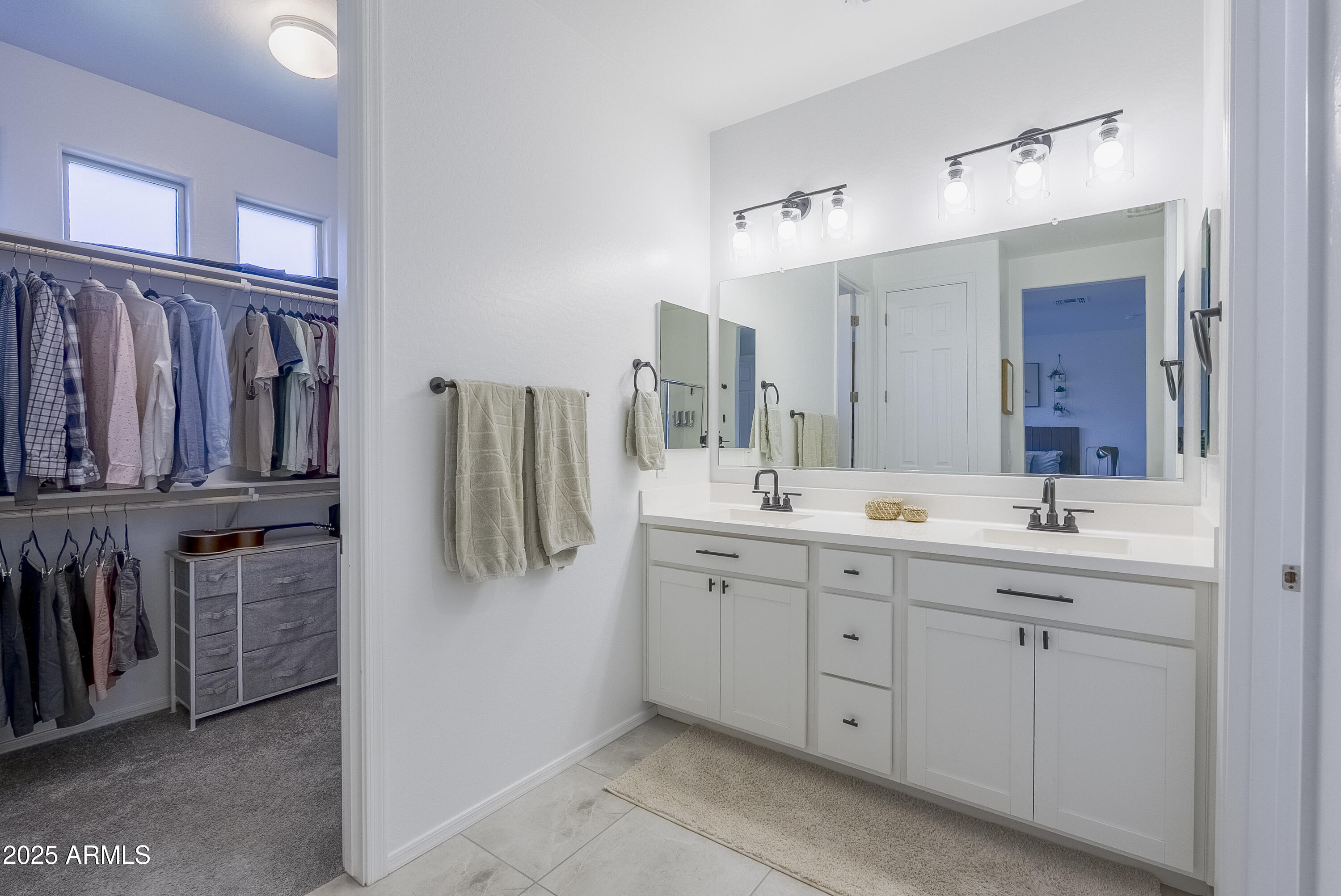22638 East Quintero Court Queen Creek, AZ 85142 - Photo 22 of 39 a bathroom with a double vanity sink and mirror