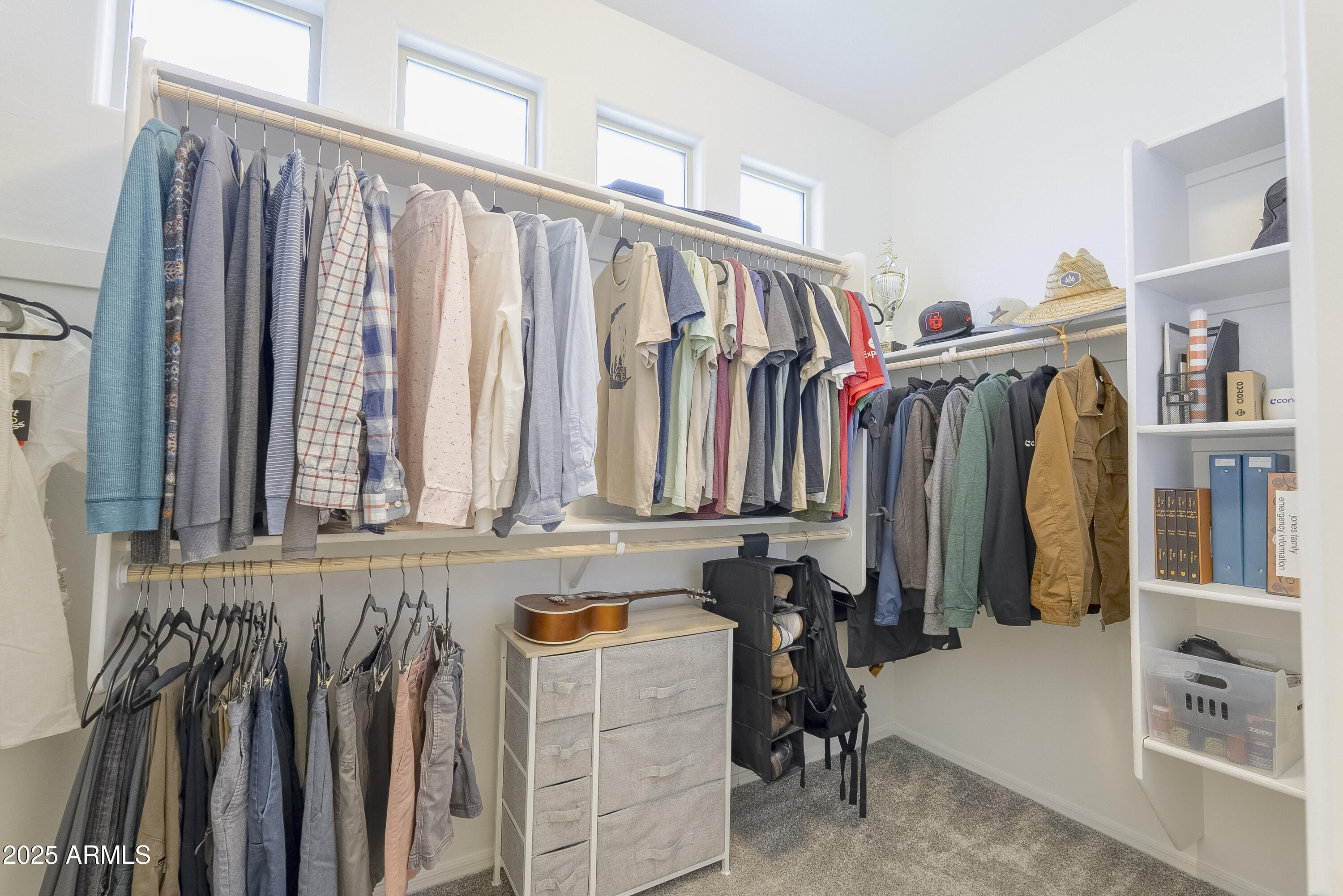 22638 East Quintero Court Queen Creek, AZ 85142 - Photo 23 of 39 a view of walk in closet with clothes