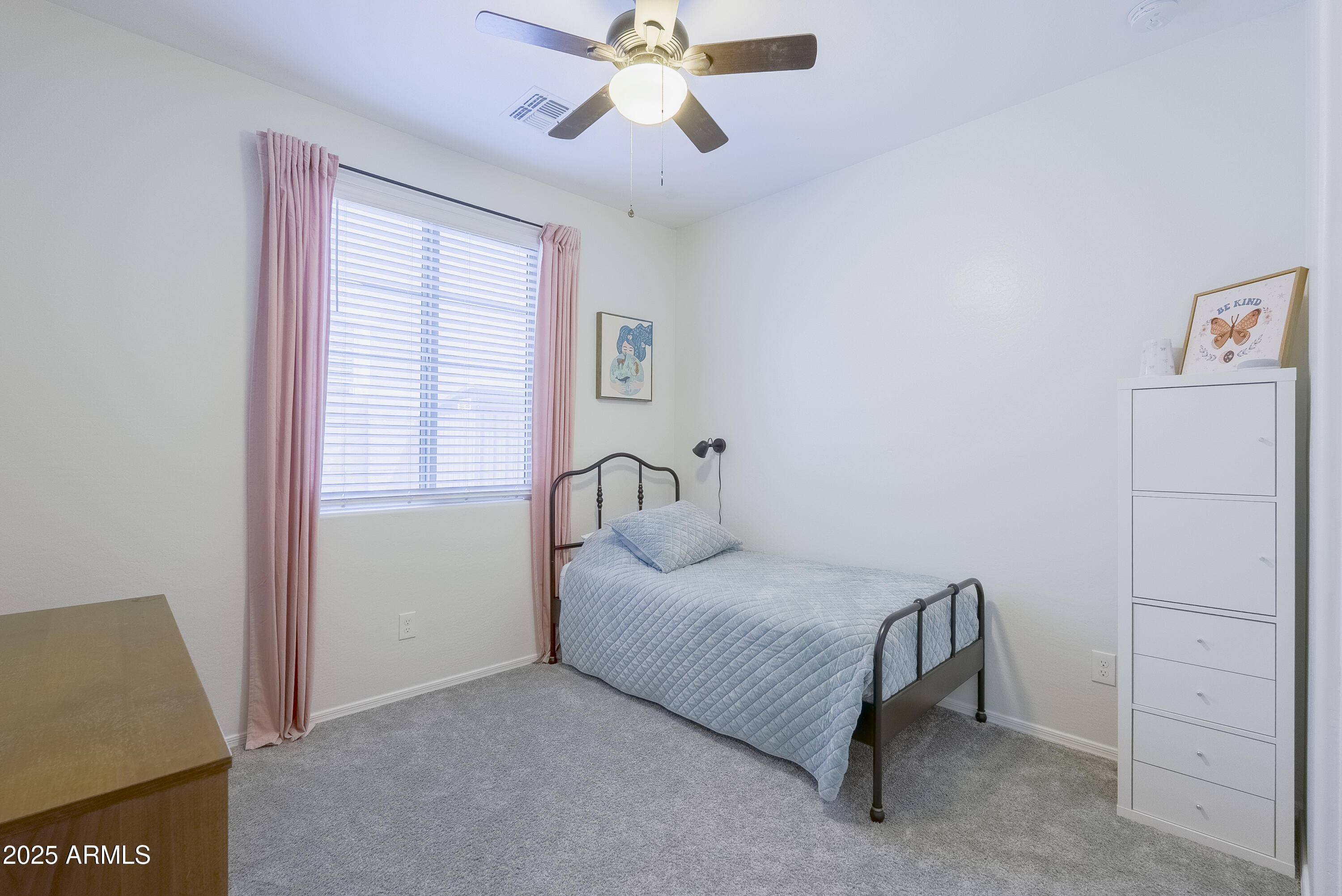22638 East Quintero Court Queen Creek, AZ 85142 - Photo 30 of 39 a bedroom with a bed and a window
