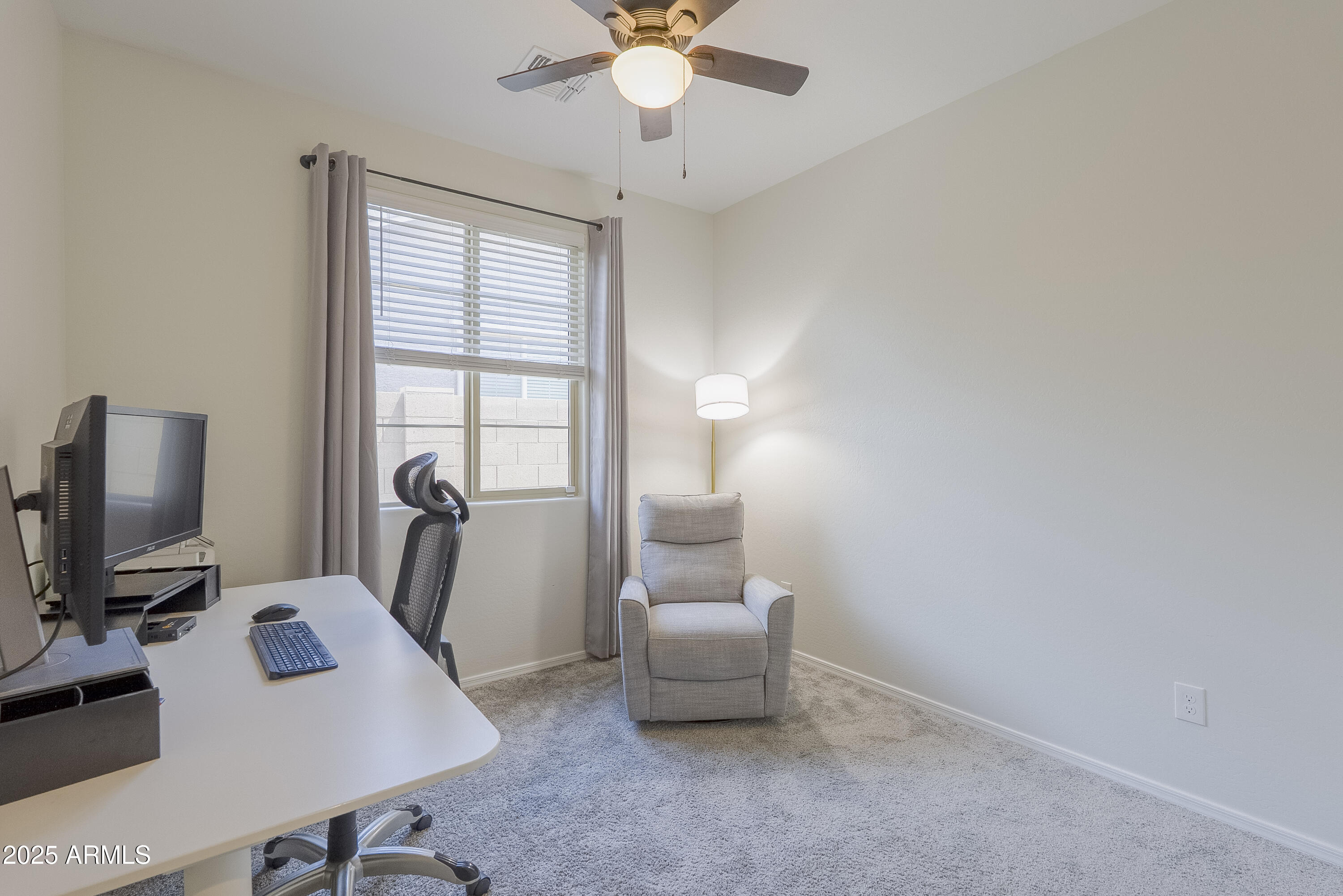 22638 East Quintero Court Queen Creek, AZ 85142 - Photo 32 of 39 a view of a workspace with furniture and a window