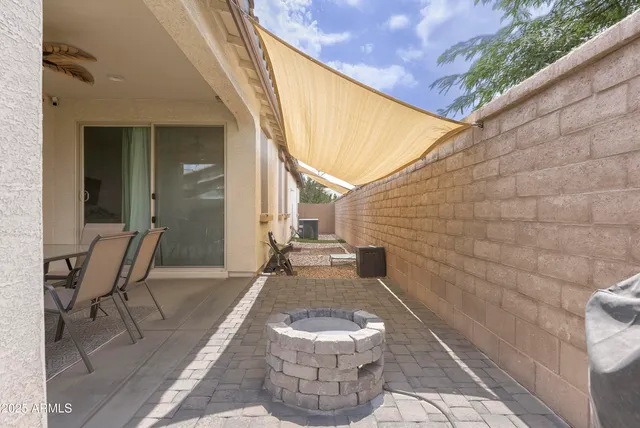 a view of a two chairs in the balcony