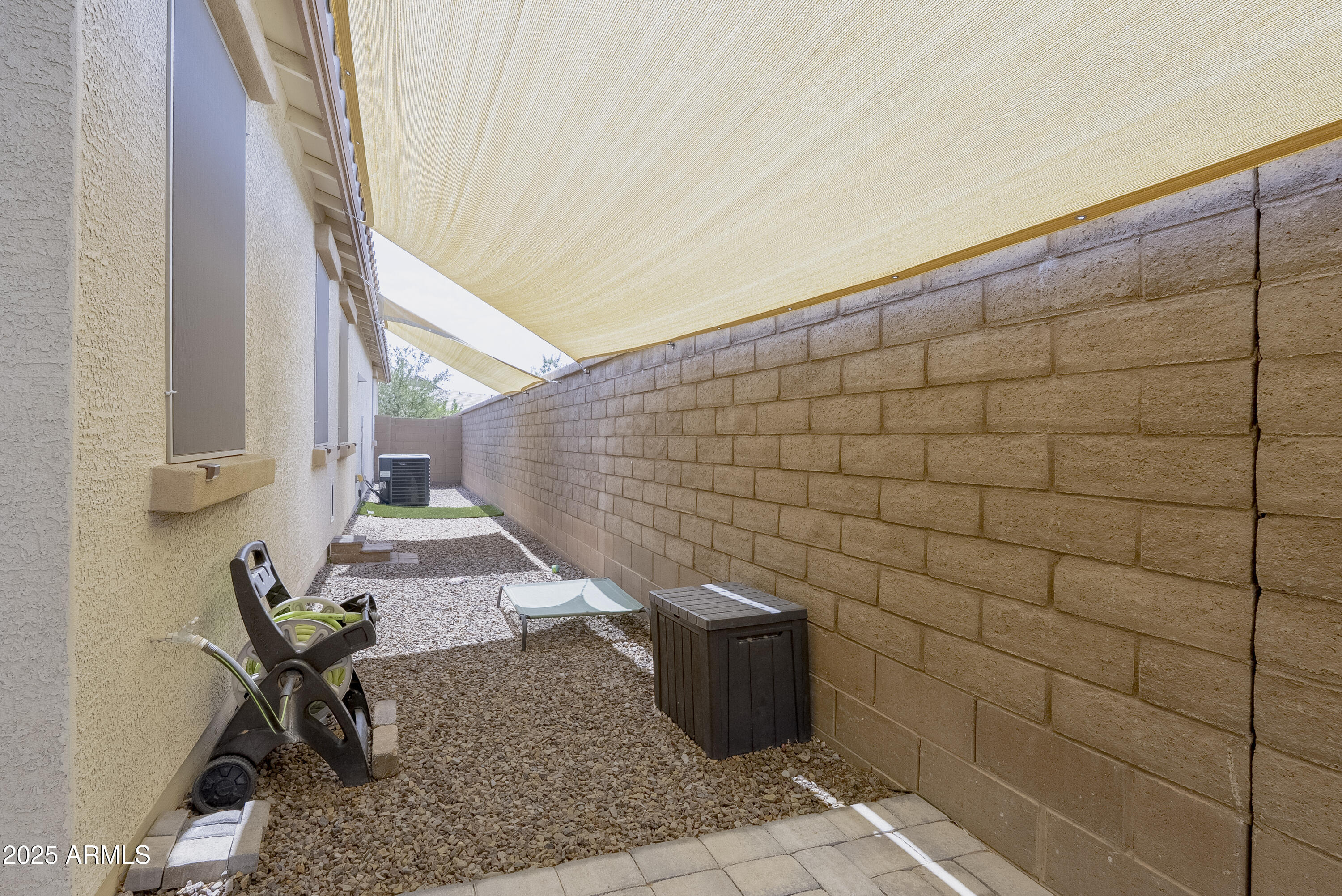 22638 East Quintero Court Queen Creek, AZ 85142 - Photo 36 of 39 a backyard of a house with table and chairs