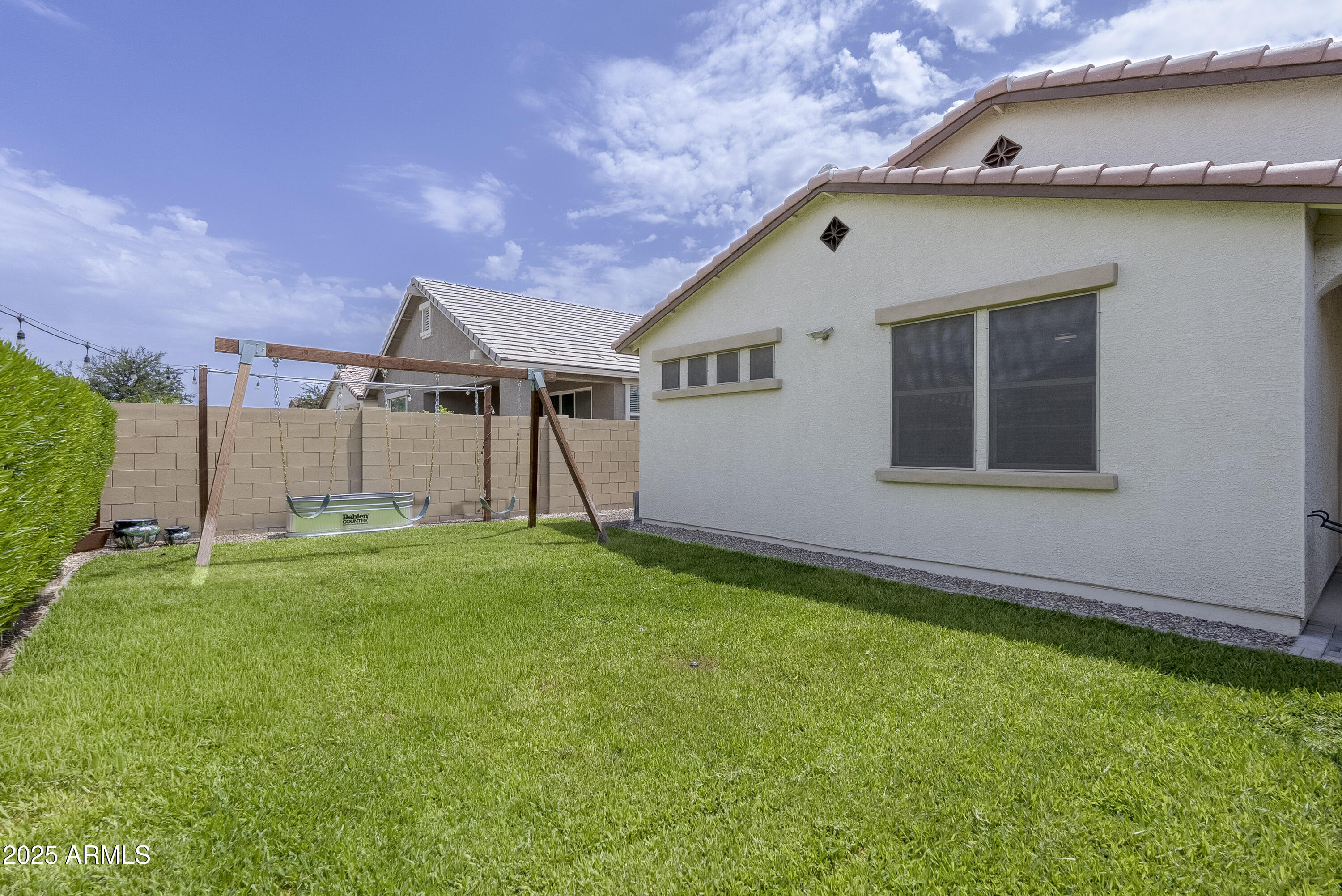 22638 East Quintero Court Queen Creek, AZ 85142 - Photo 38 of 39 a front view of a house with a yard and garage