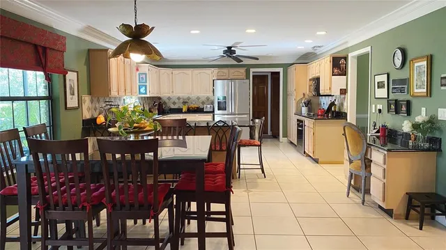 a view of a dining room with furniture window and outside view