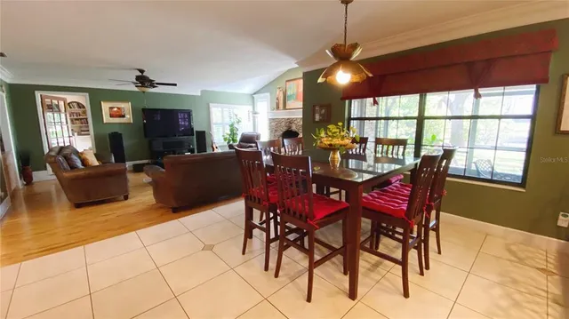 a view of a dining room with furniture window and outside view