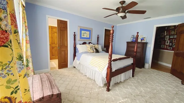 a bedroom with a bed dresser and a window