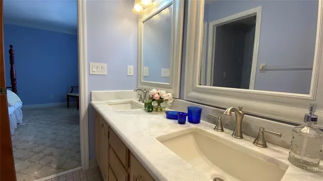 a bathroom with a sink and a mirror