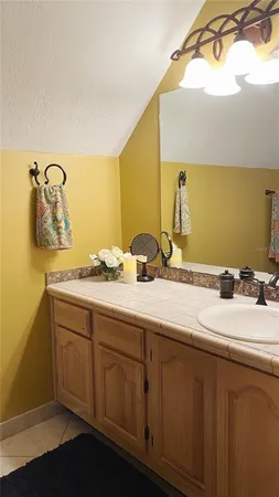 a bathroom with a double vanity sink and mirror