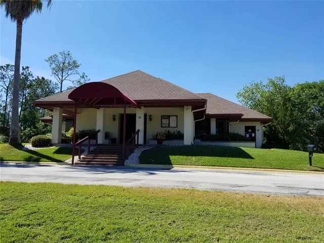a view of house with outdoor space and swimming pool