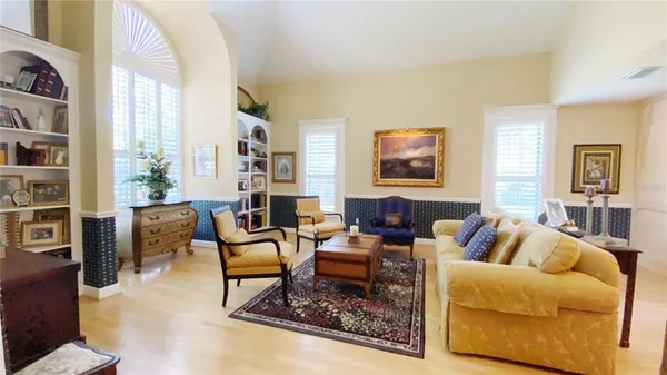 a living room with furniture or couch and a bookshelf