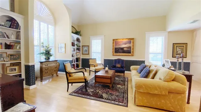 a living room with furniture or couch and a bookshelf