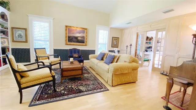 a living room with furniture and a rug