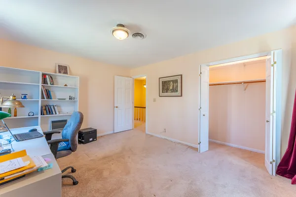 a workspace with furniture and a window