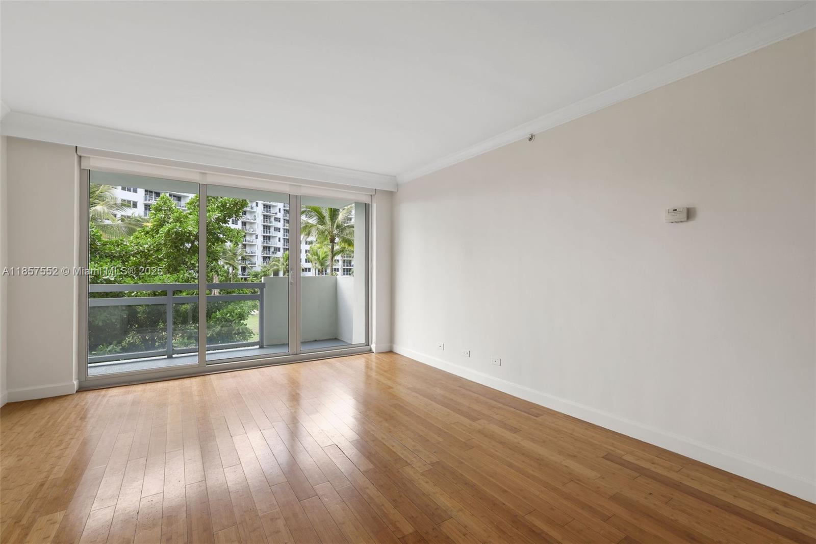 1500 Bay Road, Unit S0442 Miami Beach, FL 33139 - Photo 3 of 75 a view of a big room with wooden floor and doors