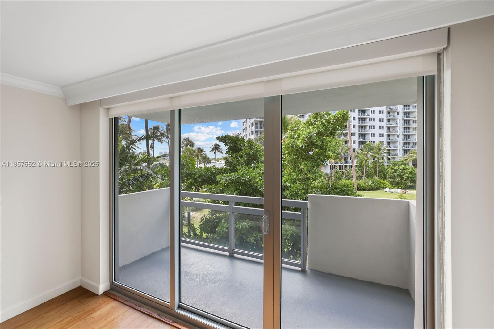 1500 Bay Road, Unit S0442 Miami Beach, FL 33139 - Photo 5 of 75 a view of empty room with wooden floor and fan
