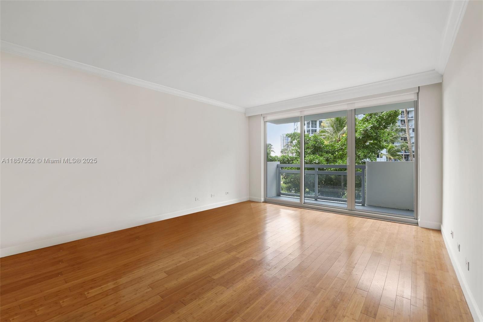 1500 Bay Road, Unit S0442 Miami Beach, FL 33139 - Photo 8 of 75 a view of empty room with wooden floor and fan