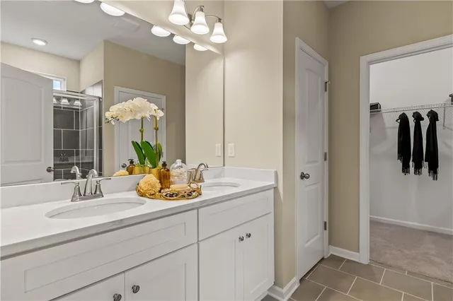 a bathroom with a glass shower door